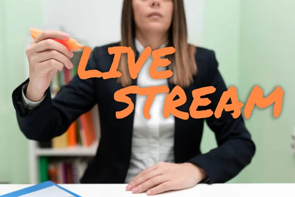Hand writing sign Live Stream, Word Written on transmit or receive video and audio coverage over Internet Businesswoman Holding Marker With One Hand And Pointing Important Ideas.