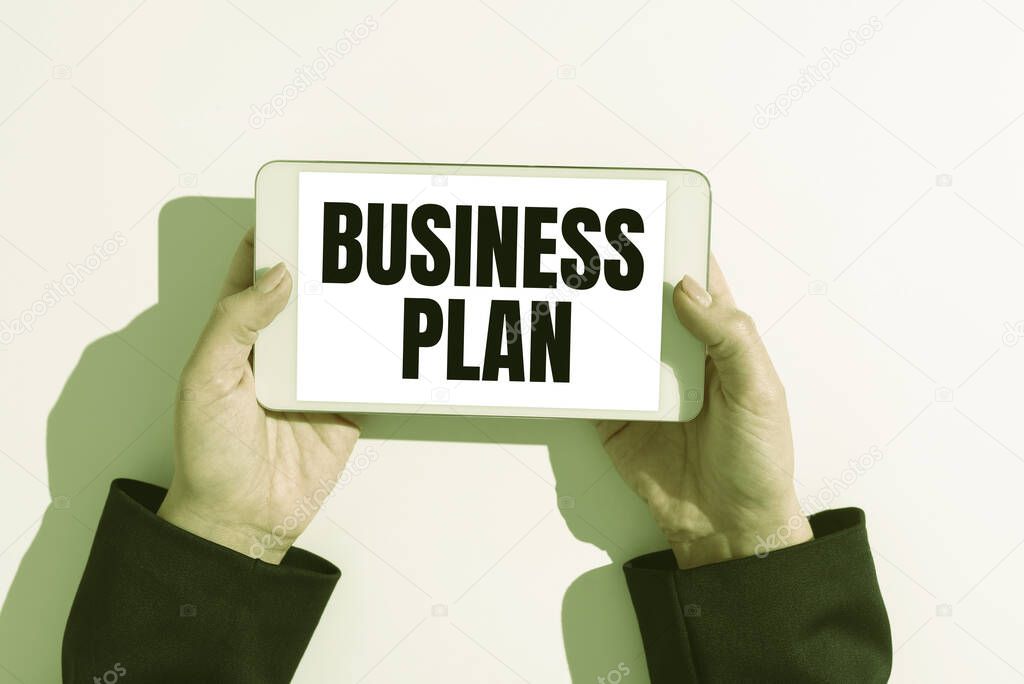 Hand writing sign Business Plan, Word Written on Structural Strategy Goals and Objectives Financial Projections Businesswoman Holding Cellphone And Presenting Important Informations.