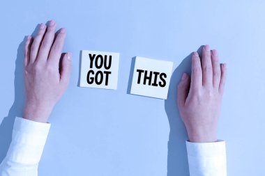 Hand writing sign You Got This, Business idea Inspiration to do it understanding Motivation Positivity Businesswoman Presenting Different Informations On Two Notes.