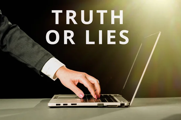 Writing displaying text Truth Or Lies, Business showcase Decide between a fact or telling a lie Doubt confusion Businesswoman Typing Recent Updates On Lap Top Keyboard On Desk.