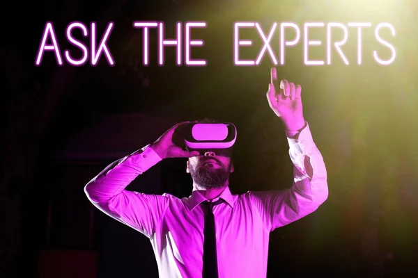 Handwriting text Ask The Experts, Internet Concept Look for a professional advice consultation support Businessman Using Virtual Reality Simulator And Gesturing During Training.