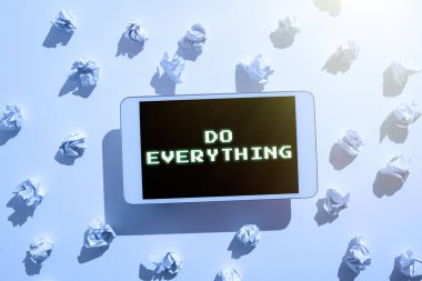 Sign displaying Do Everything, Word for Jack of All Trades Self Esteem Ego Pride No Limits Paper Wraps Placed Around Tablet With Important Informations.