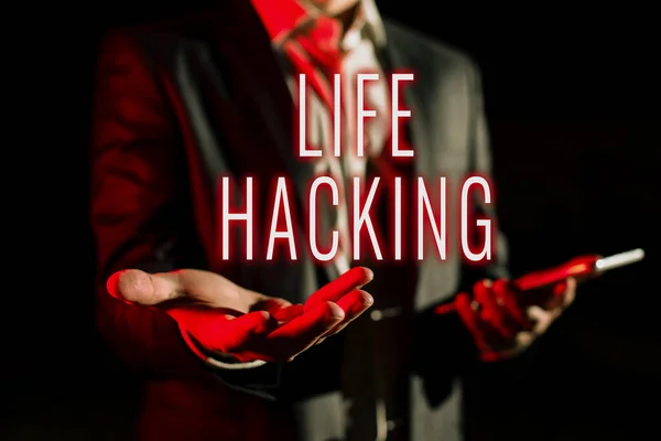 Text sign showing Life Hacking, Business idea Simple and clever techniques in accomplishing task easily Businessman In Suit Holding New Important Message In One Hand.