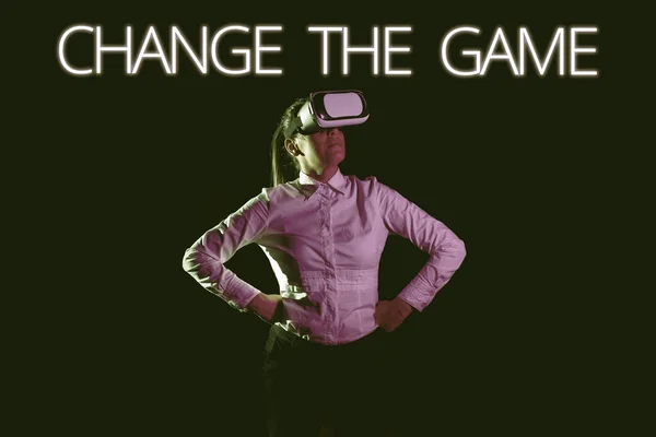 Text caption presenting Change The Game, Business concept Make a movement do something different new strategies Woman Taking Professional Training Through Virtual Reality Headset.