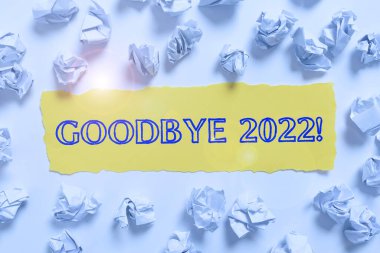 Handwriting text Goodbye 2022, Business idea New Year Eve Milestone Last Month Celebration Transition Crumpled Notes Placed All Over Written Important Informations On Paper.