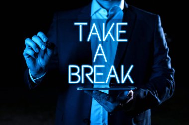 Hand writing sign Take A Break, Word Written on Resting Stop doing something recreation time get out of work Hand With Pen Pointing Important Infortmations With Other Holding Tablet