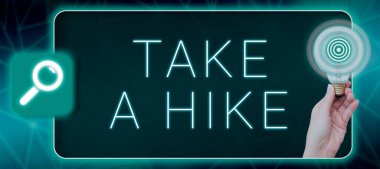 Conceptual caption Take A Hike, Business showcase Go on an adventure activity backpacking living in nature Woman Holding Light Bulb With Digital Target Presenting New Ideas.
