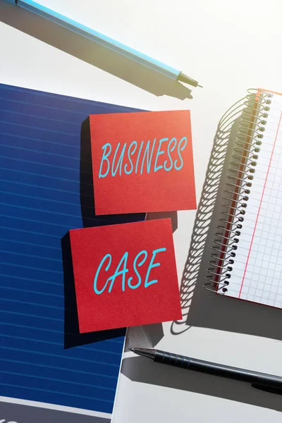 Sign displaying Business Case, Business idea Proposition Undertaking Verbal Presentation New Task Important News Presented On Two Sticky Notes On Desk With Notebook And Pens
