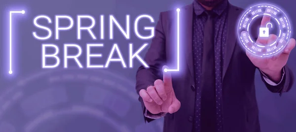 Inspiration showing sign Spring Break, Business overview Vacation period at school and universities during spring Man Pointing With Two Fingers On Design With Padlock And Presenting New Data