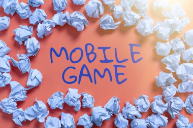 Sign displaying Mobile Game, Business concept they are entertaining programs made to work on smart device Paper Wraps Arranged In Circle With Crutial Announcement Inside.