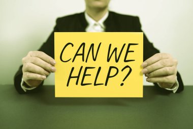 Text caption presenting Can We Help, Internet Concept Offering assistance support expert advice for your problems Businesswoman Holding Note With Important Message On Office Desk.