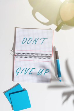 Conceptual caption Don T Not Give Up, Conceptual photo Determined Persevering Continue to Believe in Yourself Notebook With New Ideas On Both Sides On Desk With Coffee, Pen And Notes.