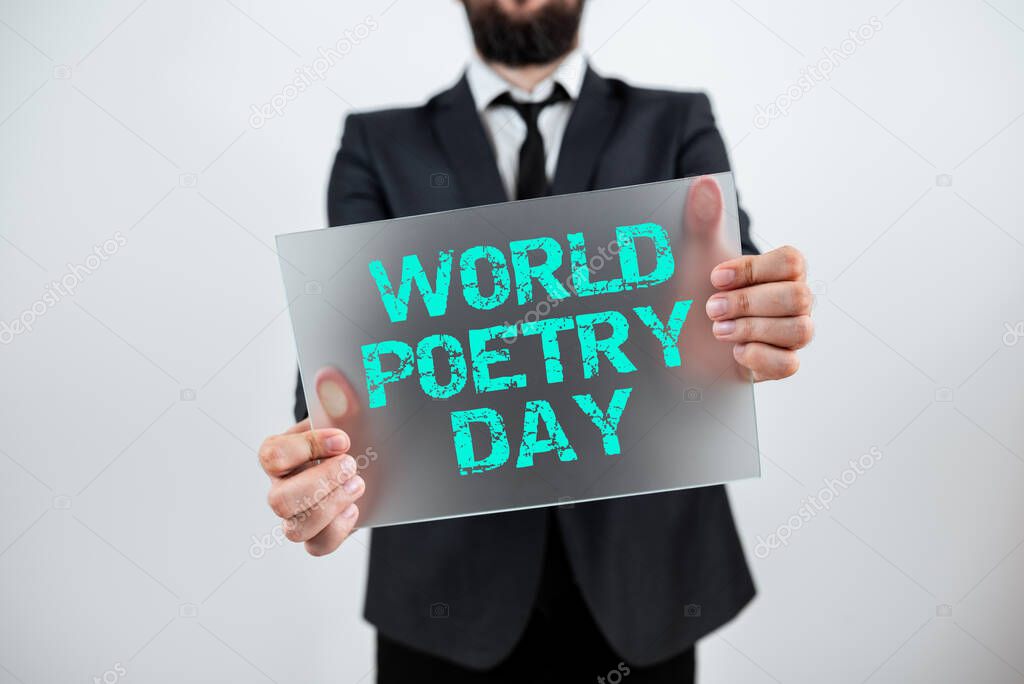 Conceptual display World Poetry Day, Word Written on Worldwide literature celebration reading books time Male Professional Showing Placard And Advertising The Company.