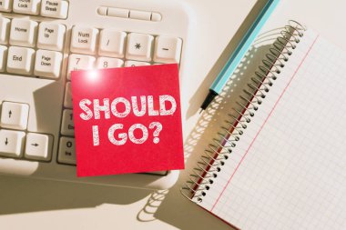 Text showing inspiration Should I Go, Business overview Looking for reasons to leave a place Doubtful Indecision Important Messages Written On Note On Desk With Pen, Notebook And Keyboard.