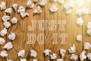 Sign displaying Just Do It, Business approach Motivation for starting doing something Have discipline Paper Wraps Arranged In Circle With Crutial Announcement Inside.