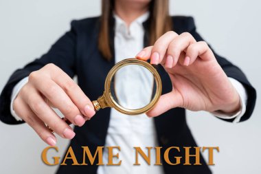 Sign displaying Game Night, Word for event in which folks get together for the purpose of getting laid Woman Having Magnifying Glass To Point Important Information.