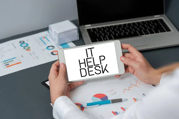 Hand writing sign It Help Desk, Business overview Online support assistance helping showing with technology Businesswoman Holding Tablet With Important Informations On It.