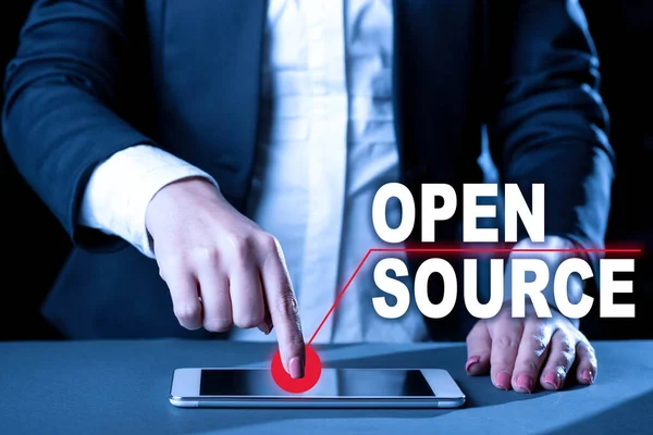 Conceptual display Open Source, Business showcase denoting software which original source code freely available Businesswoman Having Tablet On Desk And Pointing On It With One Finger.