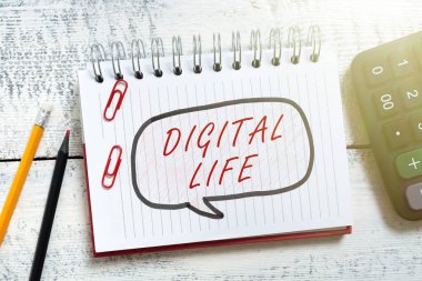 Conceptual caption Digital Life, Business idea Living in a world interconnected through Internet Multimedia Speech Bubble With New Messages Written On Notebook On Floor.
