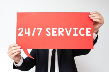 Handwriting text 24 7 Service, Conceptual photo Always available to serve Runs constantly without disruption Businessman Holding Speech Bubble With Important Informations.
