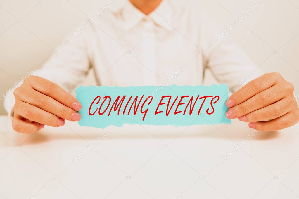 Sign displaying Coming Events, Business overview Happening soon Forthcoming Planned meet Upcoming In the Future Businesswoman Holding Note With Important Message On Office Desk.