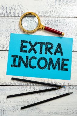 Text caption presenting Extra Income, Business idea Additional fund received or earned from a non regular basis Piece Of Paper With New Ideas With Magnifier And Pencils Around.