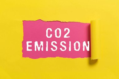 Hand writing sign Co2 Emission, Business idea Releasing of greenhouse gases into the atmosphere over time Important Information Written Underneath Ripped Piece Of Paper.