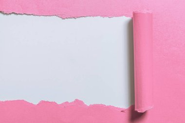 Tear On Sheet Reveals Background With Pen On Board