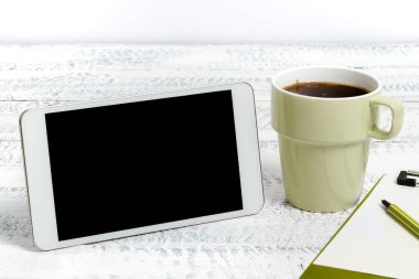 Phone With Important Message On Desk With Paperclip, Pen, Notes And Coffee.