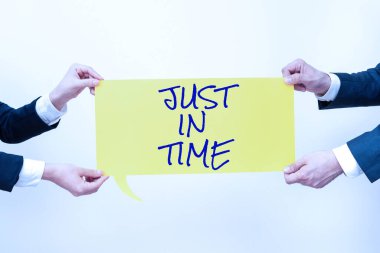 Handwriting text Just In Time, Business approach Arriving exactly at hour required Punctuality Responsibility Business Team Holding Important Information On Speech Bubble On Both Sides.