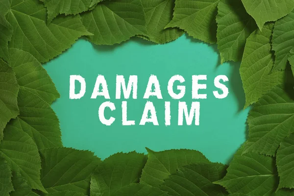 Inspiration showing sign Damages Claim, Conceptual photo Demand Compensation Litigate Insurance File Suit Important Informations Written On Paper Under Lot Of Leaves.