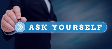 Text caption presenting Ask Yourself, Word for Thinking the future Meaning and Purpose of Life Goals Man Holding A Tablet Projecting A Camera Showing Creative Photography.