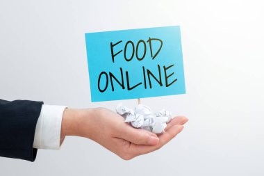 Conceptual display Food Online, Conceptual photo asking for something to eat using phone app or website Businesswoman Holding Paper Wraps And Important Message On Stick.
