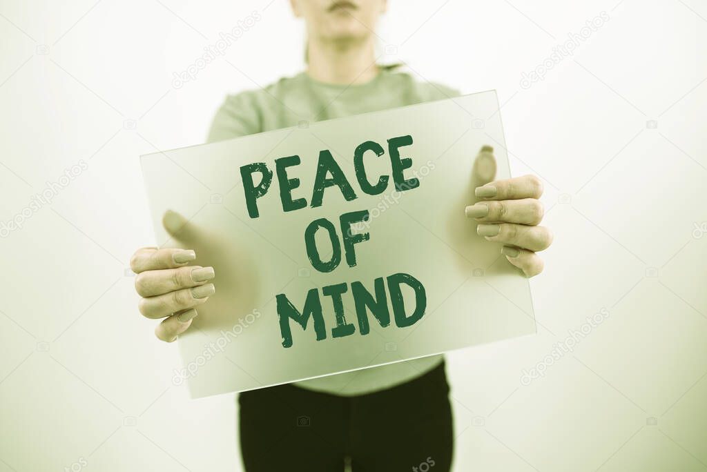 Writing displaying text Peace Of Mind, Business idea To be peaceful happy with things you have done and accomplish Businesswoman Holding Blank Placard And Advertising The Business.