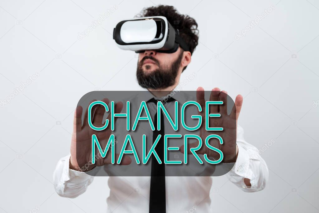 Text caption presenting Change Makers, Business approach Young Turk Influencers Acitivists Urbanization Fashion Gen X Man Wearing Vr Glasses And Presenting Important Messages Between Hands.