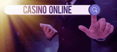 Writing displaying text Casino Online, Concept meaning Computer Poker Game Gamble Royal Bet Lotto High Stakes Businessman in suit holding tablet symbolizing successful teamwork.