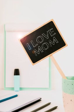 Conceptual display I Love Mom, Business showcase Good feelings about my mother Affection loving happiness Small Blackboard With Important Message In Cup On Desk With Clipboard.