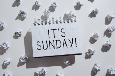 Text caption presenting It S Is Sunday, Business idea Day of rest and religious worship Part of the weekend Notepad With Important Informations Surrounden By Paper Wraps.