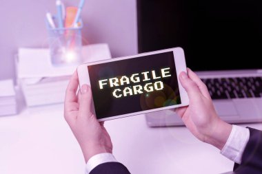 Text sign showing Fragile Cargo, Business approach Breakable Handle with Care Bubble Wrap Glass Hazardous Goods Sitting Businesswoman Holding Mobile Phone With Important Messages.