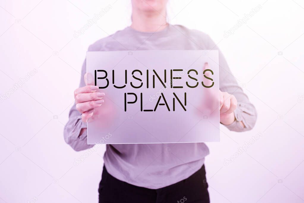 Inspiration showing sign Business Plan, Concept meaning Structural Strategy Goals and Objectives Financial Projections Businesswoman Holding Blank Placard And Advertising The Business.