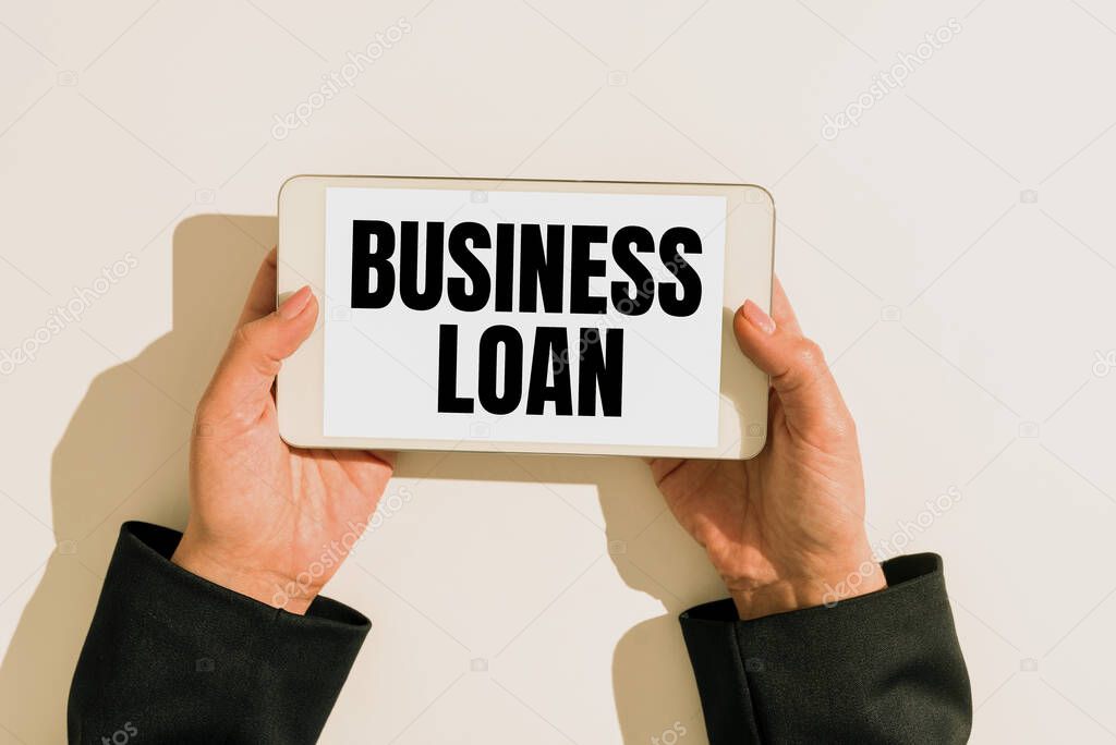 Hand writing sign Business Loan, Internet Concept Credit Mortgage Financial Assistance Cash Advances Debt Businesswoman Holding Cellphone And Presenting Important Informations.