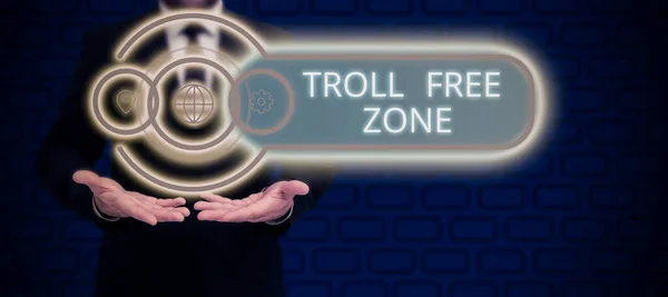 Conceptual caption Troll Free Zone, Business idea Social network where tolerance and good behavior is a policy Man Pointing On Glowing Digital S And Receiving Crucial Information.