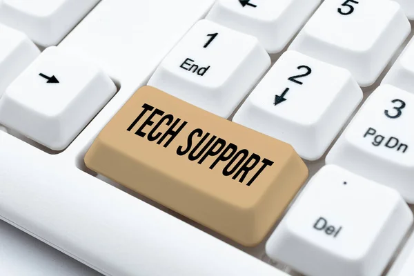 Hand writing sign Tech Support, Word for Help given by technician Online or Call Center Customer Service Lady in suit holding pen symbolizing successful teamwork accomplishments.