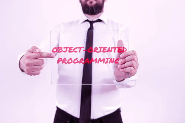Sign displaying Object Oriented Programming, Business showcase Language model objects rather than actions Man Holding Tablet And Pen Pointing On Search Bar And Presenting New Ideas.
