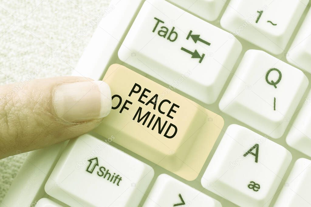 Conceptual display Peace Of Mind, Word for To be peaceful happy with things you have done and accomplish New Ideas Presented On Desk With Pen, Note, Clip, Cup And Keyboard Around.
