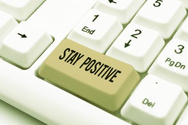 Writing displaying text Stay Positive, Concept meaning Be Optimistic Motivated Good Attitude Inspired Hopeful Paper With Speech Bubble And Stationery Over Wood Presenting New Ideas.