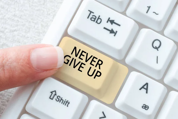 Sign displaying Never Give Up, Conceptual photo Keep trying until you succeed follow your dreams goals Businessman Holding Speech Bubble With Important Informations.