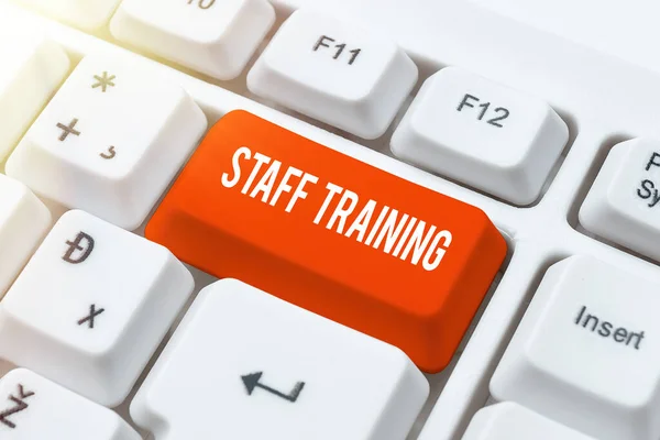 Sign Displaying Staff Traininga Program Helps Employees Learn Specific Knowledge — Stockfoto