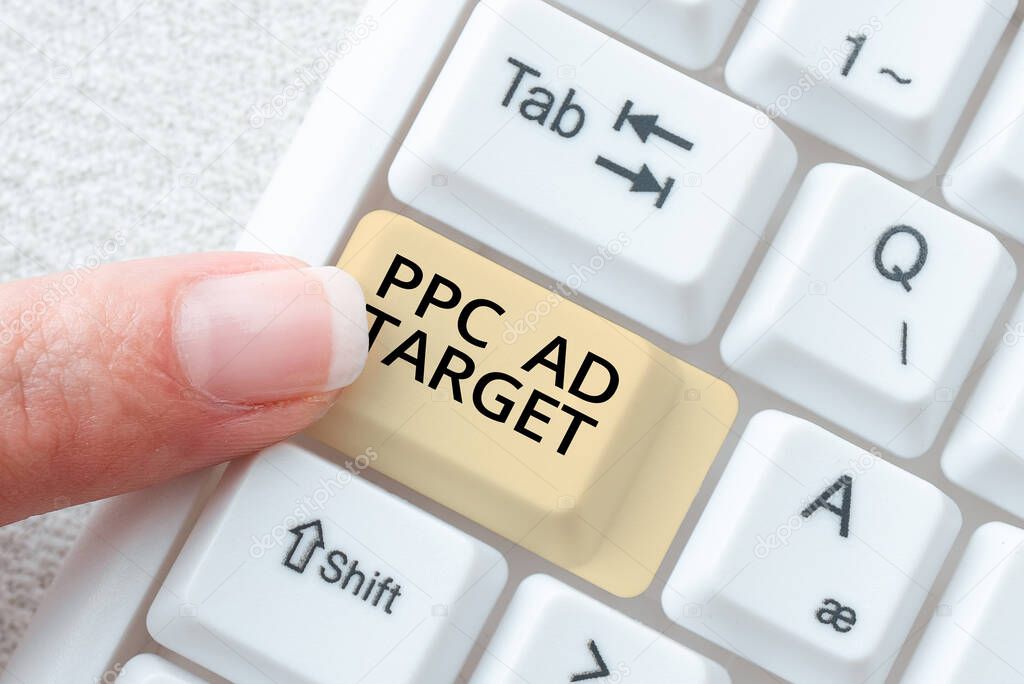 Text sign showing Ppc Ad Target, Business showcase Pay per click advertising marketing strategies online campaign New Ideas Presented On Desk With Pen, Note, Clip, Cup And Keyboard Around.