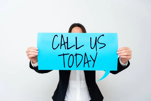 Hand writing sign Call Us Today, Business overview Make a telephone calling to ask for advice or support Important Messages Presented On Piece Of Paper On Desk With Books.